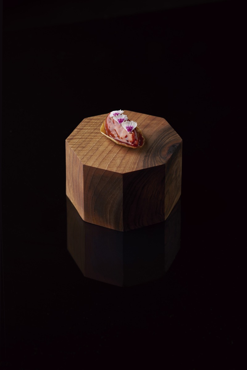 a-delicate-pastry-on-a-wooden-block