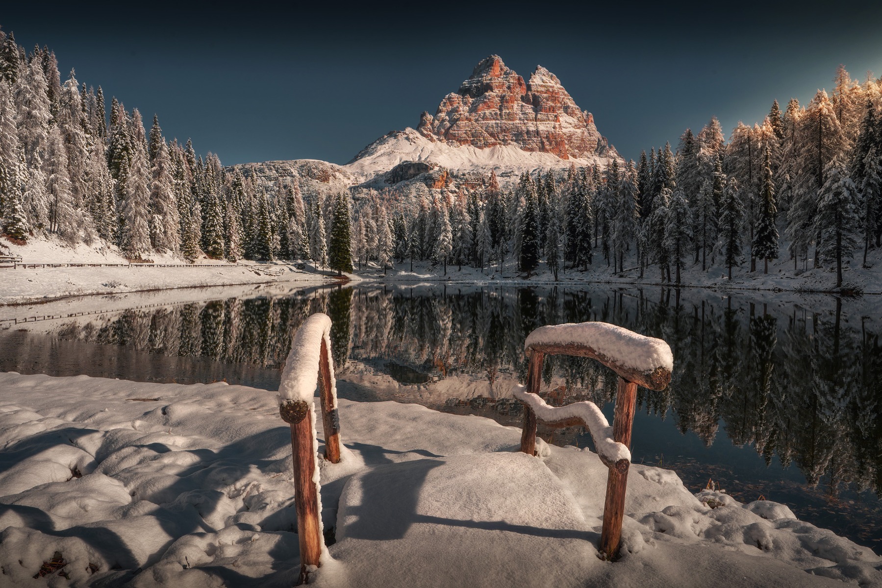 mountain-lake-surrounded-by-snow